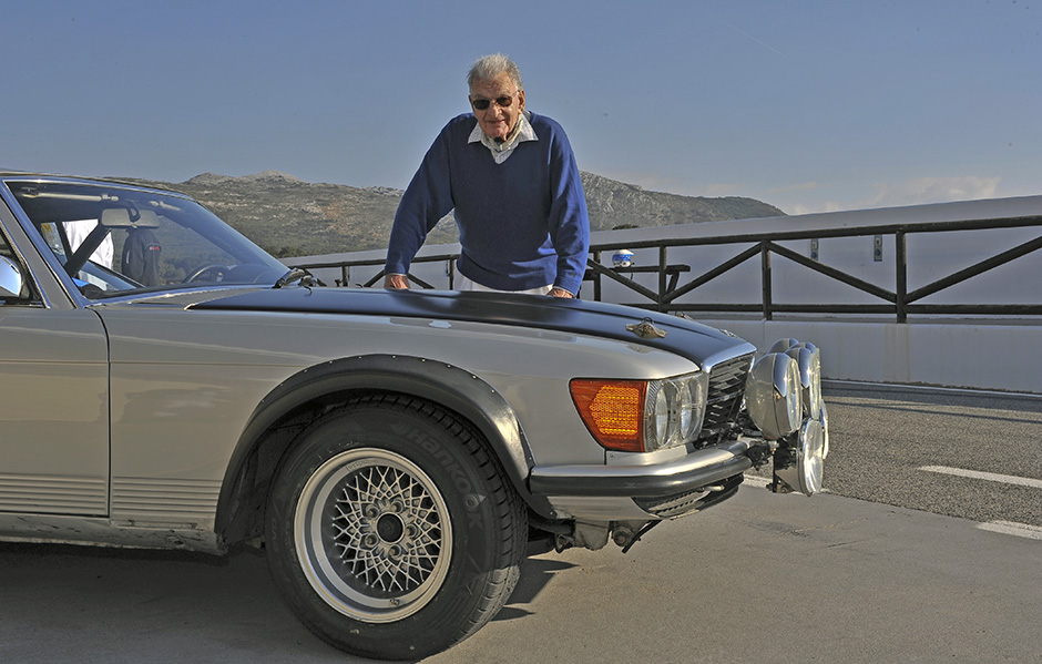 Mercedes-Benz' prolific engineer, Erich Waxenberger, poses recently with the 500SL he created for the 1981 World Championship Rally season. We see the '80s era BBS wheels, standard bumpers perhaps in aluminum and massive lamps for high speed night stages. Rocker and side moldings have been removed as has the production car's shallow front chin spoiler.